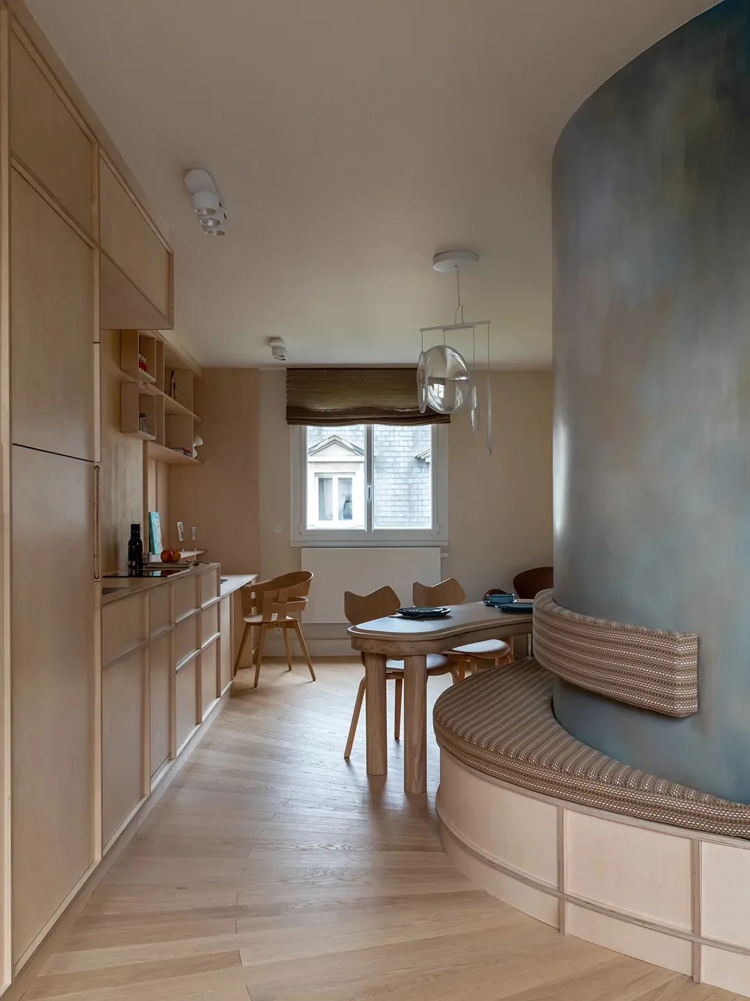 How a Paris Designer Turned an Awkward Curved Wall Into a Clever Kitchen Layout