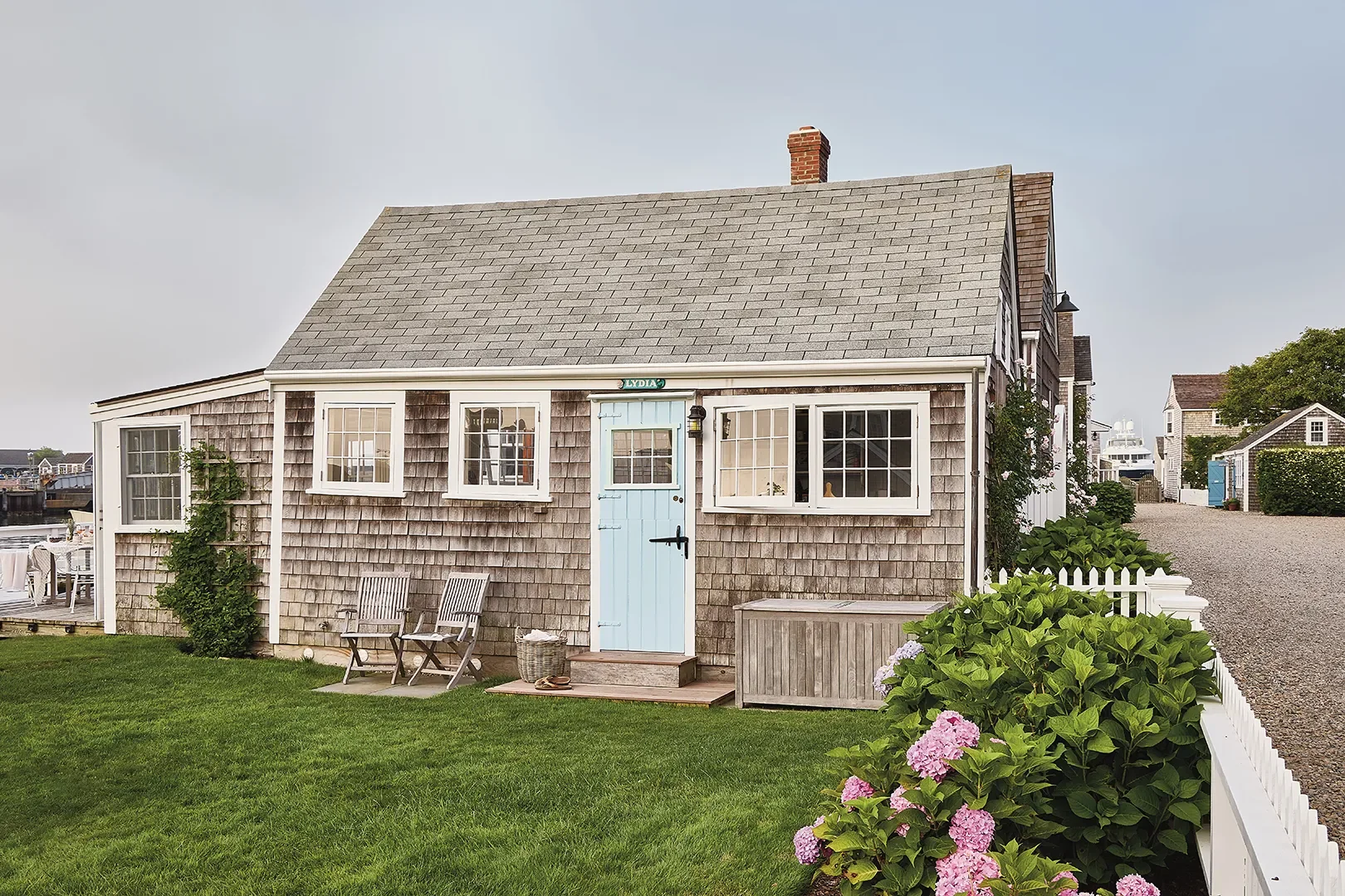 A White Picket Fence Previews the Coastal Charm Inside This Tiny Nantucket Cottage